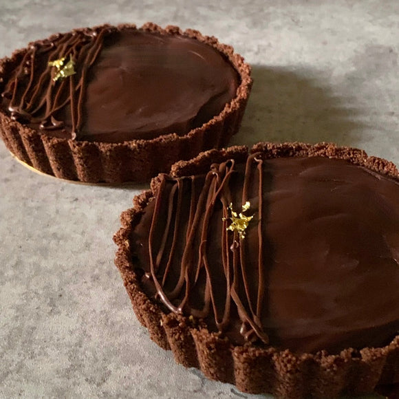 Vegan and gluten-free mini chocolate tarts topped with gold leaf made to order in Trinidad