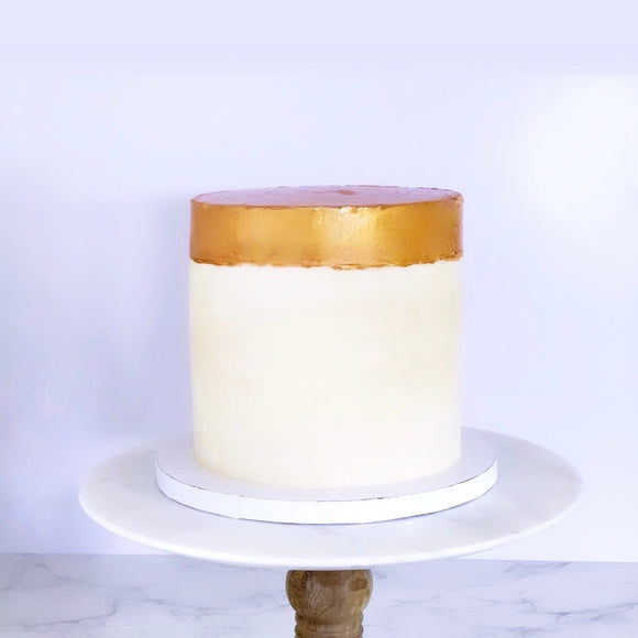 Vegan buttercream cake with a show-stopping gold painted top made to order in Trinidad
