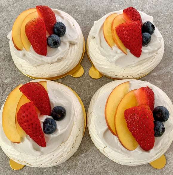 Vegan mini pavlovas topped with coconut cream and mixed fruit made to order in Trinidad