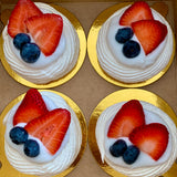 Vegan mini pavlovas topped with coconut cream and fresh berries made to order in Trinidad