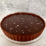 Vegan and gluten-free chocolate tart topped with flaked sea salt made to order in Trinidad