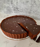 Vegan and gluten-free chocolate tart topped with flaked sea salt made to order in Trinidad