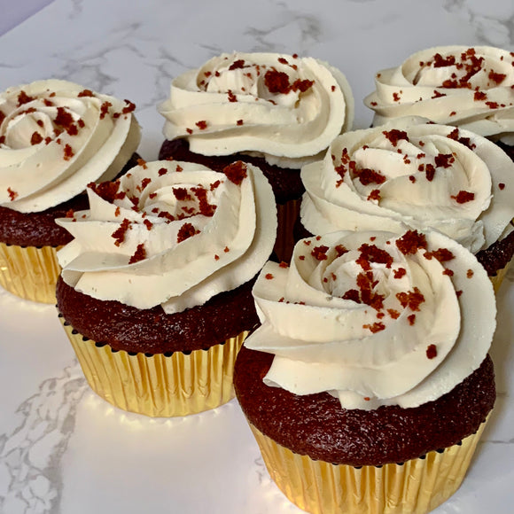 Vegan red velvet cupcakes topped with vanilla buttercream and red velvet crumbles made to order in Trinidad