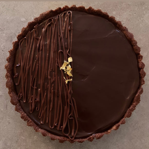 Vegan and gluten-free chocolate tart topped with gold leaf made to order in Trinidad